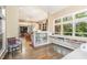 Open-concept room with custom built-ins and cabinetry and hardwood flooring at 27425 Walker, Chapel Hill, NC 27517