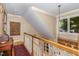Bright hallway landing with natural light, decorative rug, and architectural details at 27425 Walker, Chapel Hill, NC 27517