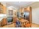 Kitchen showcasing wood cabinets, stainless steel appliances, and a functional island with seating at 27425 Walker, Chapel Hill, NC 27517