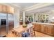 Bright kitchen with stainless steel appliances, a kitchen island, and an open layout leading to the living room at 27425 Walker, Chapel Hill, NC 27517