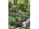 Beautiful landscaping featuring different plants, mulch and a stone border at 27425 Walker, Chapel Hill, NC 27517