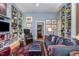 Cozy living room features custom built-in bookshelves, comfortable seating, and lots of natural light at 27425 Walker, Chapel Hill, NC 27517
