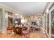 Spacious living room featuring hardwood floors, a stone fireplace, and staircase access at 27425 Walker, Chapel Hill, NC 27517