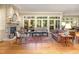 Bright living room with stone fireplace, hardwood floors, and large windows offering scenic views at 27425 Walker, Chapel Hill, NC 27517