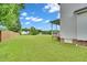 A large, well-maintained backyard features lush green grass and a classic white home exterior at 31 Bucking Saddle Way, Willow Springs, NC 27592