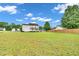 Extensive backyard provides ample space, highlighted by a two-story home and partial fencing at 31 Bucking Saddle Way, Willow Springs, NC 27592