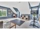 A spacious bonus room offers versatile space with natural light and a modern exercise bike setup at 31 Bucking Saddle Way, Willow Springs, NC 27592