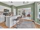 Inviting kitchen with a breakfast bar, open layout, and view into the living area at 31 Bucking Saddle Way, Willow Springs, NC 27592