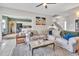 Bright living room with an open layout, seamlessly connecting to the kitchen and staircase at 31 Bucking Saddle Way, Willow Springs, NC 27592