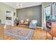 Stylish living room featuring a decorative wall, modern lighting, and hardwood floors at 31 Bucking Saddle Way, Willow Springs, NC 27592