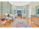 Bright living room with a bay window, hardwood floors, and tasteful furnishings at 31 Bucking Saddle Way, Willow Springs, NC 27592