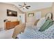 Spacious main bedroom with a vaulted ceiling, ceiling fan, warm tones, and dresser for storage at 31 Bucking Saddle Way, Willow Springs, NC 27592