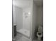 Elegant bathroom features a walk-in shower with tiled walls, a modern design, and neutral colors at 310 E Woodall St, Smithfield, NC 27577
