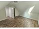 Cozy bedroom features hardwood floors, a walk-in closet, and natural light from a window at 310 E Woodall St, Smithfield, NC 27577