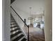 View of an open floor plan, stairs, and luxury vinyl plank flooring at 310 E Woodall St, Smithfield, NC 27577