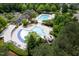 Aerial view of community pools with a water slide, swimming lanes, and ample seating at 312 Bridgegate Dr, Cary, NC 27519