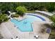 Aerial view of community pool with water slide and shaded lounge areas at 312 Bridgegate Dr, Cary, NC 27519