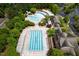 Aerial view of community pools featuring swimming lanes, recreational water slide, and shaded seating at 312 Bridgegate Dr, Cary, NC 27519