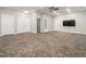 Expansive basement area featuring neutral carpeting, ceiling fan and doorways at 312 Bridgegate Dr, Cary, NC 27519
