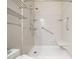 Accessible shower with grab bars and a built-in seat, designed for comfort and safety at 312 Bridgegate Dr, Cary, NC 27519