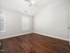 This bedroom features hard wood floors, a ceiling fan, neutral paint, and large shuttered windows at 312 Bridgegate Dr, Cary, NC 27519