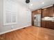 Cozy dining area featuring hardwood floors and stainless steel refrigerator at 312 Bridgegate Dr, Cary, NC 27519