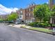 Charming brick townhome featuring a two-car garage and manicured landscaping at 312 Bridgegate Dr, Cary, NC 27519