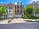 Attractive townhome with brick facade, two-car garage, and well-maintained front yard at 312 Bridgegate Dr, Cary, NC 27519