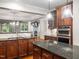 Well-equipped kitchen with island, granite counters and stainless steel appliances at 312 Bridgegate Dr, Cary, NC 27519