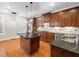 Updated kitchen with granite countertops, stainless steel appliances, and a center island at 312 Bridgegate Dr, Cary, NC 27519