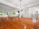 Expansive living room boasting hardwood floors, a fireplace, and ample natural light at 312 Bridgegate Dr, Cary, NC 27519