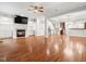 Spacious living room with fireplace, hardwood floors, and open floor plan at 312 Bridgegate Dr, Cary, NC 27519