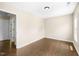 Bedroom with wood floors and a door that leads to another room in the house at 317 Chamberlain Dr, Clayton, NC 27527