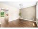 Bright dining area featuring hardwood floors and a modern chandelier at 317 Chamberlain Dr, Clayton, NC 27527
