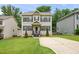 Charming two-story home with a well-maintained lawn and inviting curb appeal at 317 Chamberlain Dr, Clayton, NC 27527