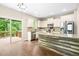 Spacious kitchen featuring stainless steel appliances, granite countertops, and an island at 317 Chamberlain Dr, Clayton, NC 27527