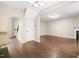 Spacious living area with hardwood floors, fireplace, and access to staircase at 317 Chamberlain Dr, Clayton, NC 27527