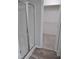 Bathroom with a glass-enclosed shower and walk-in closet with ample shelving at 3300 Neuse Crossing Dr, Raleigh, NC 27616