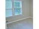 Bright bedroom featuring carpeted floors, a window, and a partially open door at 3300 Neuse Crossing Dr, Raleigh, NC 27616