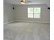 Spacious bedroom featuring wall to wall carpeting and a lighted ceiling fan at 3300 Neuse Crossing Dr, Raleigh, NC 27616