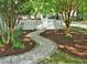 Beautifully landscaped front yard with a winding stone walkway and mature trees at 3300 Neuse Crossing Dr, Raleigh, NC 27616