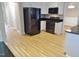 Open kitchen with stainless steel appliances, black countertops, and white cabinets at 3300 Neuse Crossing Dr, Raleigh, NC 27616