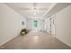 Open basement area with tile floors, a sofa, tent, and access to other rooms at 34 Johnston St, Pittsboro, NC 27312
