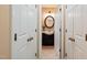 Charming bathroom with decorative mirror, vanity and fixtures, and tiled floors at 34 Johnston St, Pittsboro, NC 27312