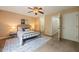 Comfortable bedroom with neutral walls, a ceiling fan, and carpeted flooring at 34 Johnston St, Pittsboro, NC 27312