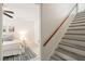 View of bedroom with ceiling fan, stylish rug, and white walls and trim at 34 Johnston St, Pittsboro, NC 27312