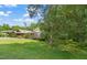 Home's exterior showcasing the lush front yard and traditional architecture at 34 Johnston St, Pittsboro, NC 27312