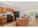 Open kitchen design with an island and seamless flow to living area at 34 Johnston St, Pittsboro, NC 27312
