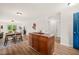 Open floorplan featuring kitchen island with view to living and dining areas at 34 Johnston St, Pittsboro, NC 27312