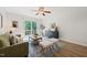 Inviting living room featuring sleek furniture, modern decor, and wood-look floors at 34 Johnston St, Pittsboro, NC 27312